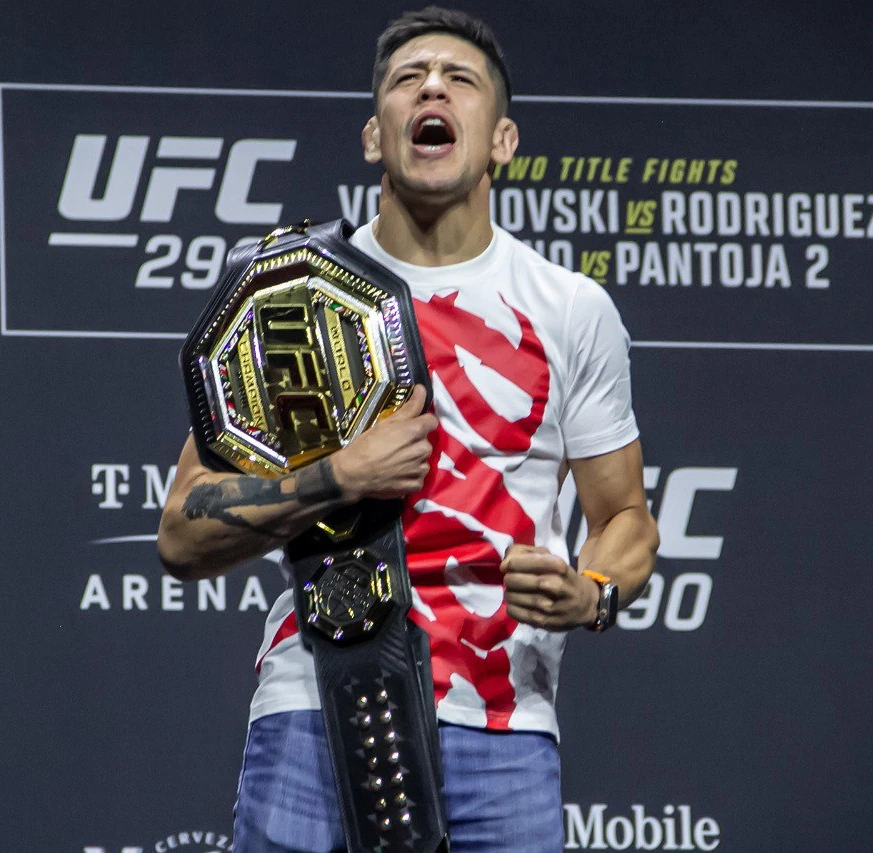 Brandon Moreno with the UFC flyweight championship belt at UFC 290